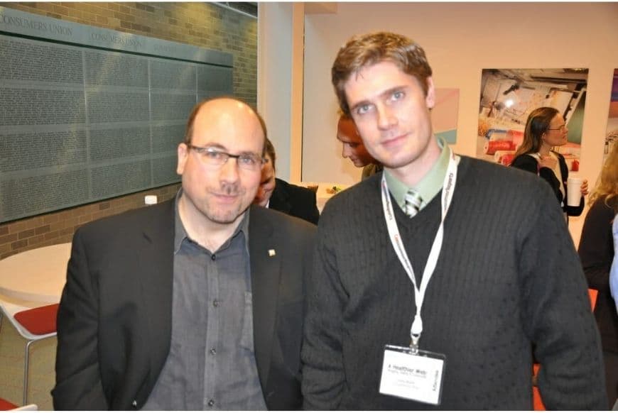 Cary and Craig Posing for a Photograph at briefing of Consumer Reports